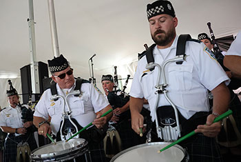 Bagpipes and Drums of the Emerald Society perform at Gaelic Park Irish Fest
